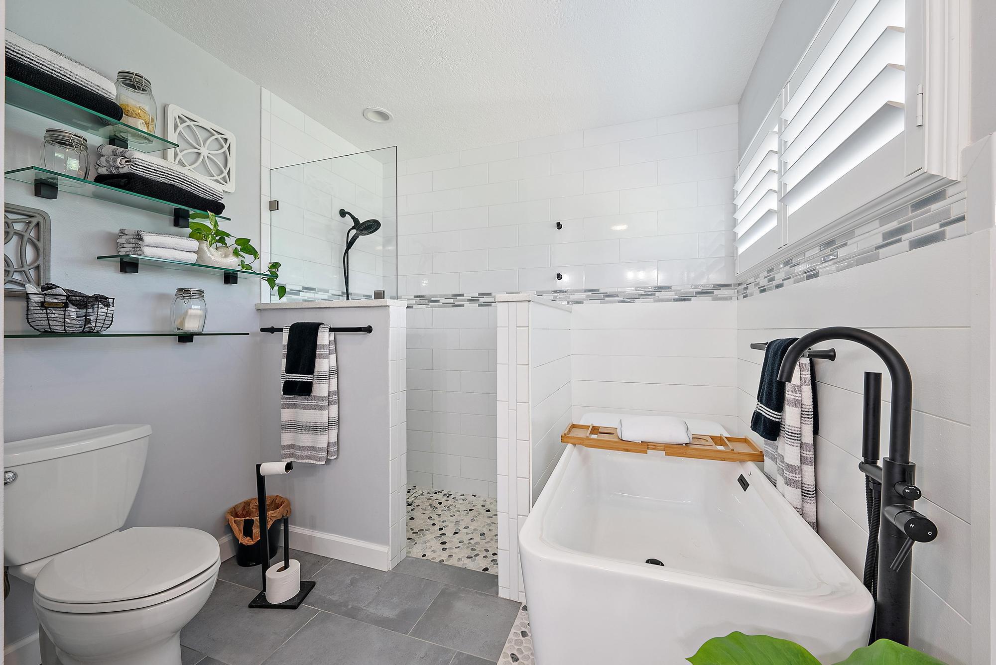 11 Loggerhead Lane Tequesta, FL 33469 - Photo 24 of 46 a bathroom with a sink toilet and shower