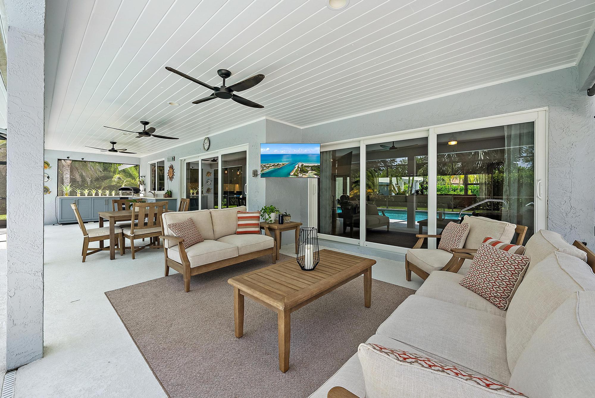 11 Loggerhead Lane Tequesta, FL 33469 - Photo 33 of 46 a living room with furniture and a large window