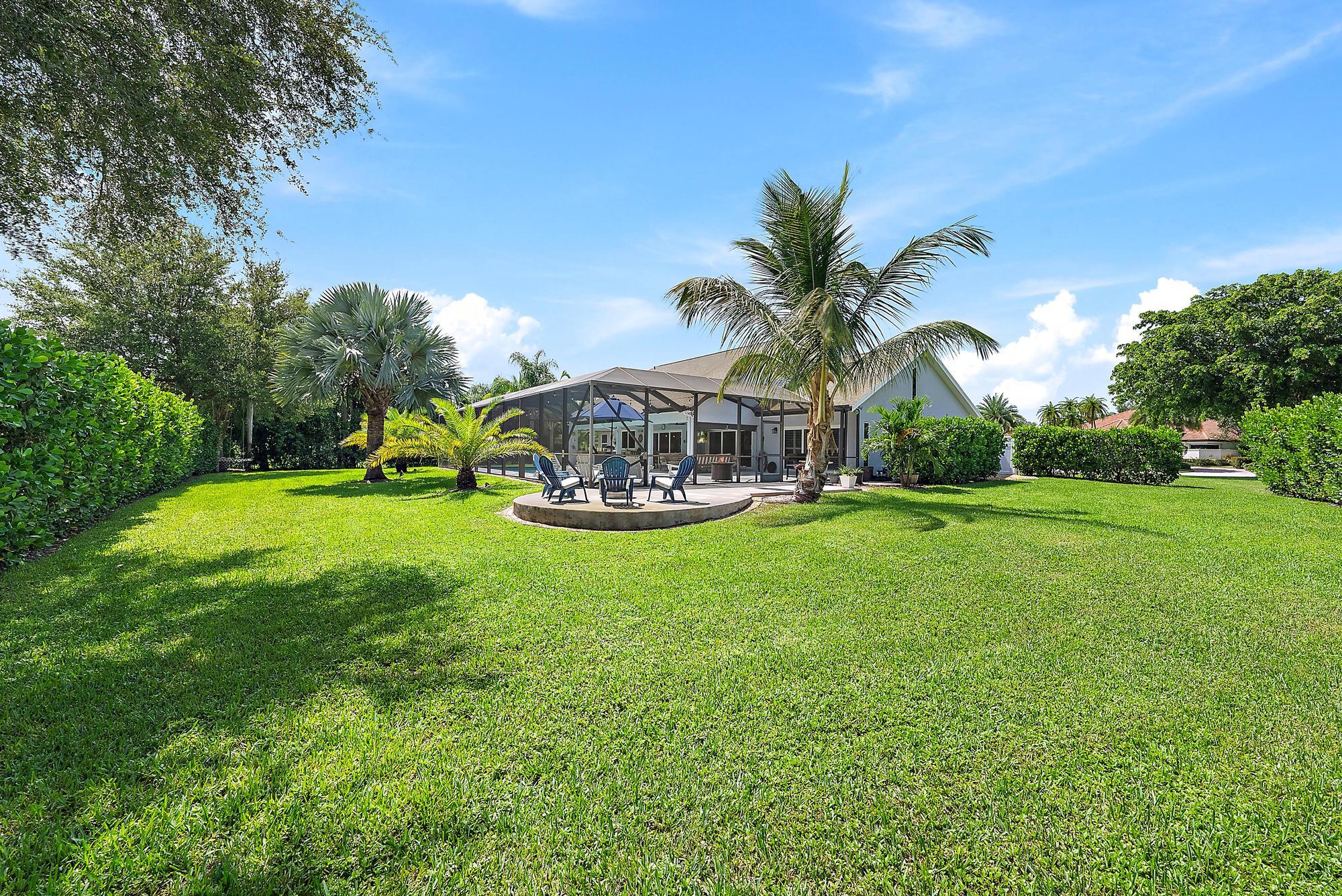 11 Loggerhead Lane Tequesta, FL 33469 - Photo 38 of 46 a view of a table and chairs in the garden