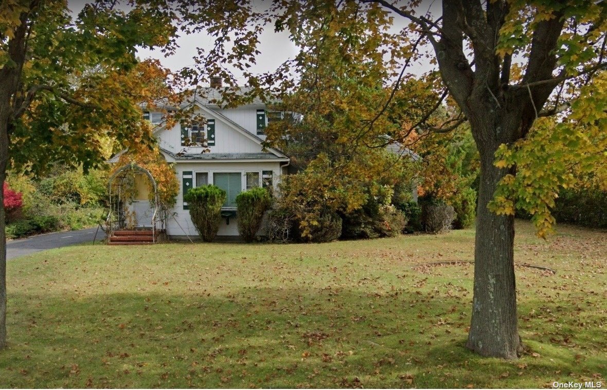 1200 West Mill Road Mattituck, NY 11952 - Photo 1 of 1 a front view of a house with a yard