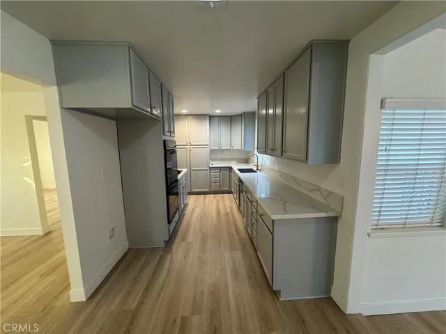 a view of a kitchen from the hallway