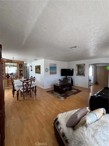 a view of a workspace with wooden floor
