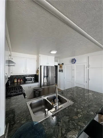 a view of hallway with livingroom and furniture