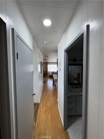 a spacious bathroom with a granite countertop sink and a mirror