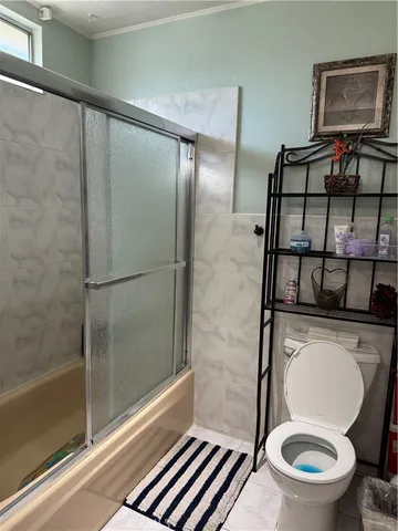 a bathroom with a granite countertop sink a mirror and vanity
