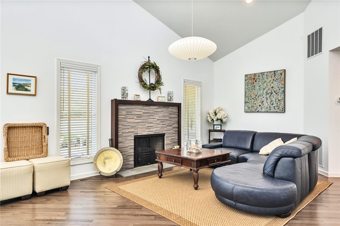 5 Wicklow Road Westerly, RI 02891 - Photo 13 of 37 The living room features high ceilings and a gas fireplace
