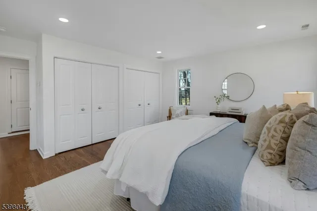 a bed room with a bed and a painting