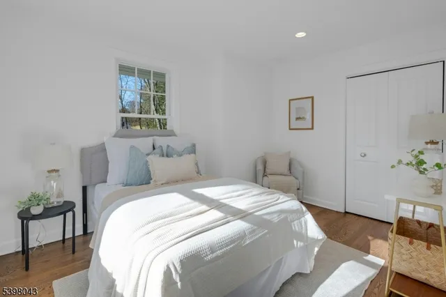 a bedroom with bed and a window