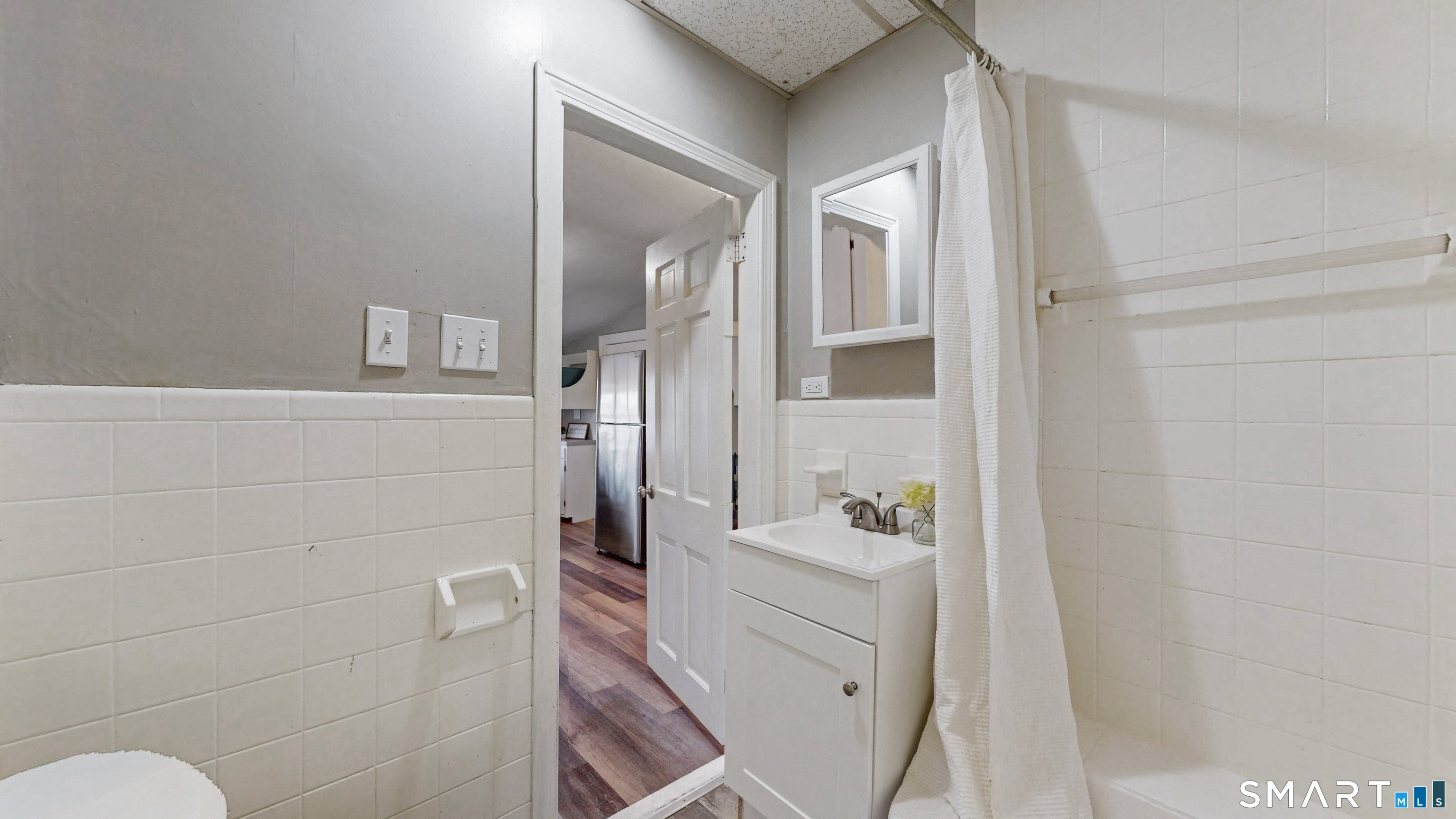 24 Madison Street Hartford, CT 06106 - Photo 18 of 18 a bathroom with a sink and mirror with toilet