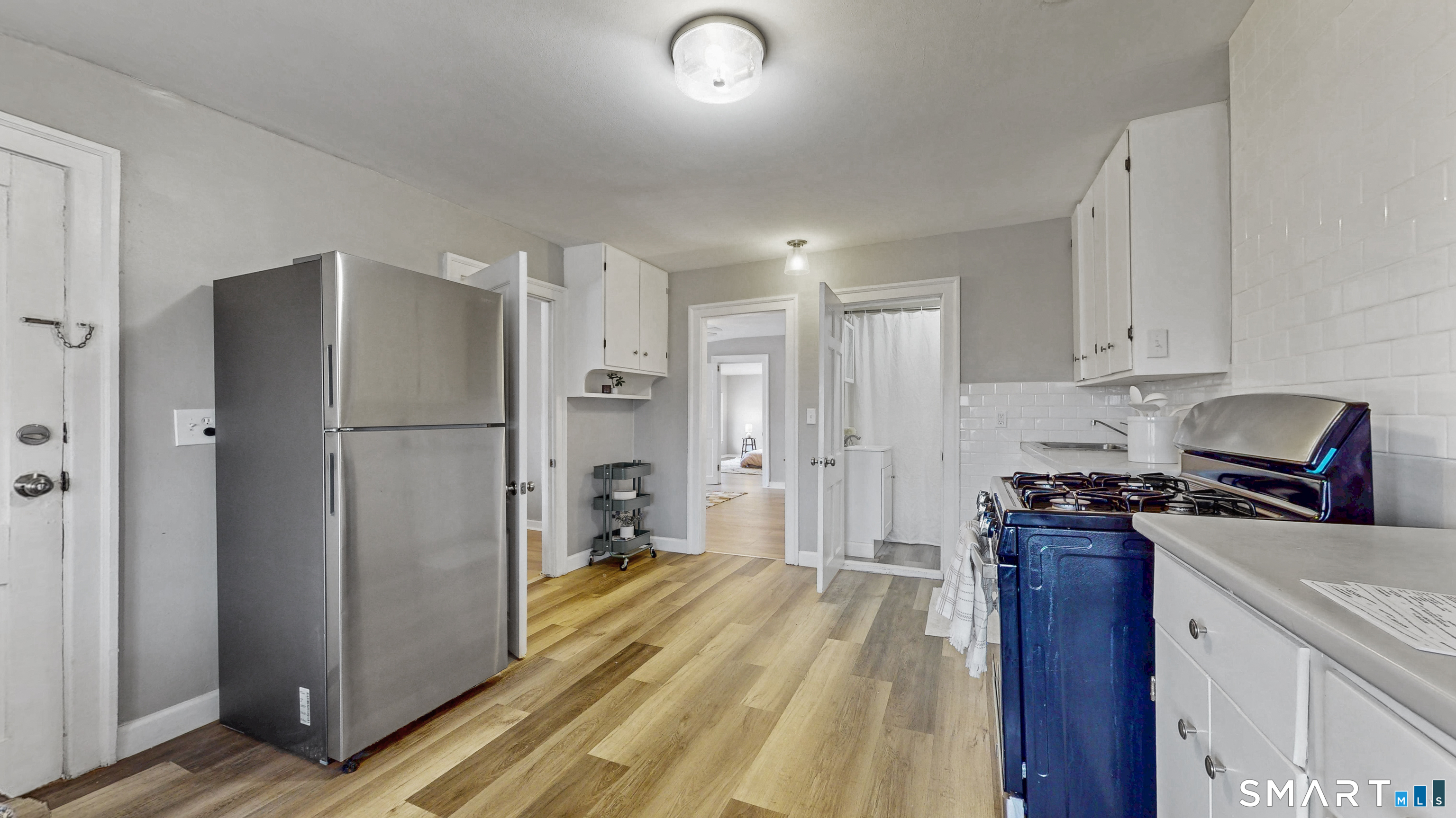24 Madison Street Hartford, CT 06106 - Photo 5 of 18 a kitchen with stainless steel appliances granite countertop a refrigerator stove and sink