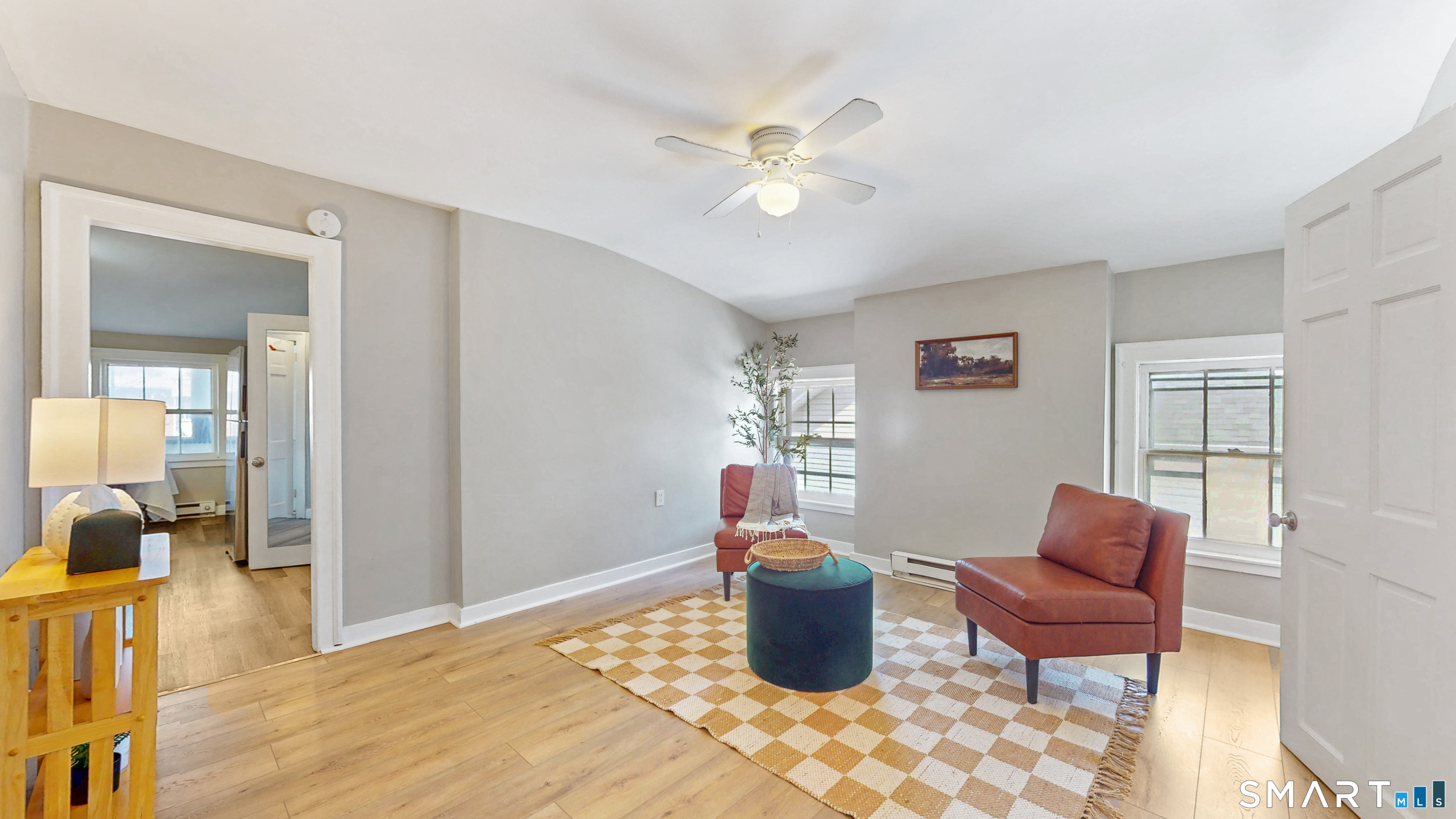 24 Madison Street Hartford, CT 06106 - Photo 10 of 18 a living room with furniture a rug and a chandelier