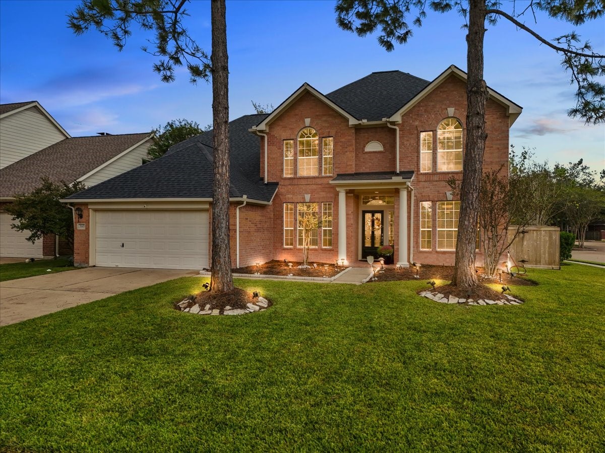 front view of a house with a yard