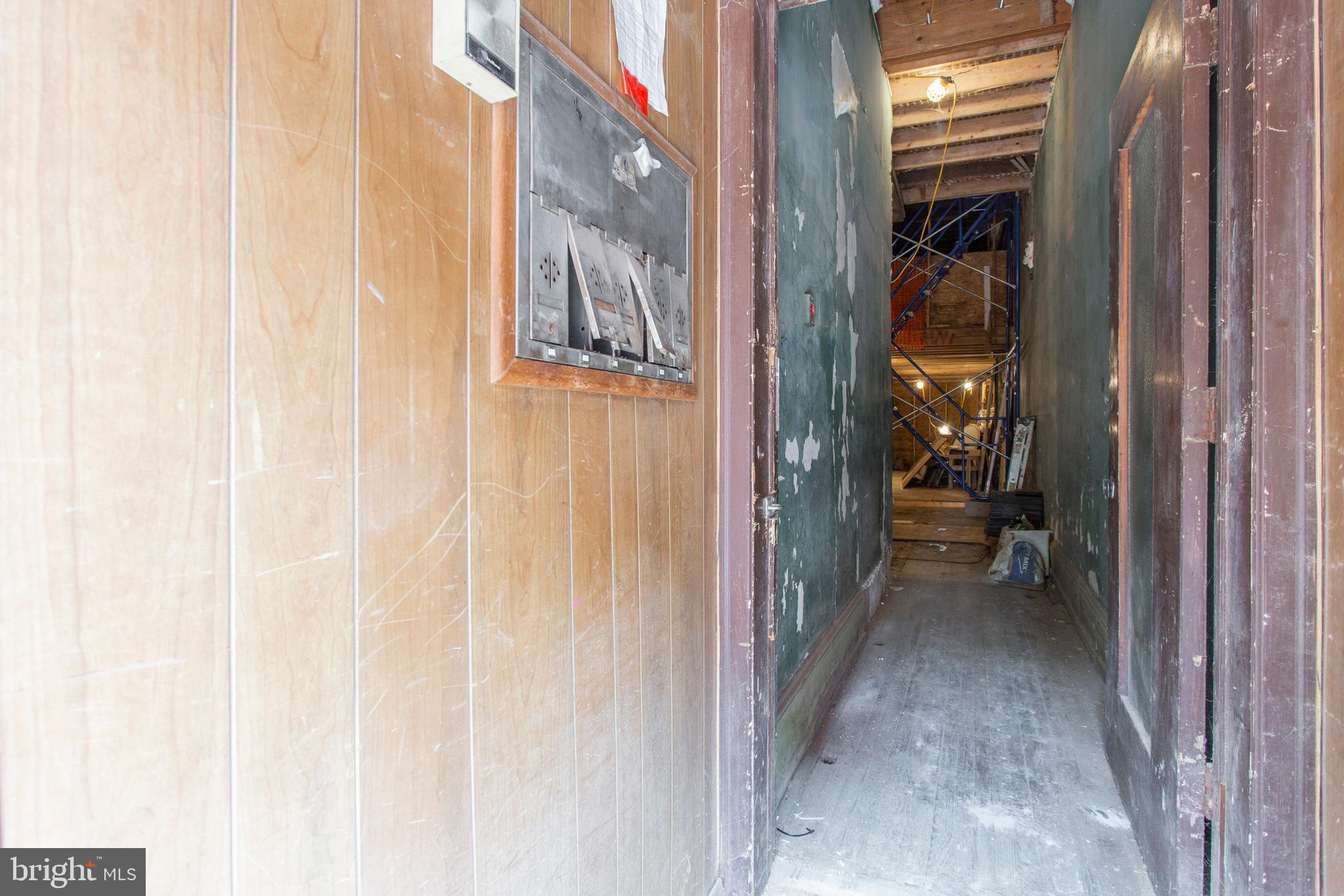 325 South 18th Street Philadelphia, PA 19103 - Photo 5 of 16 a view of a hallway with a white walls and stairs