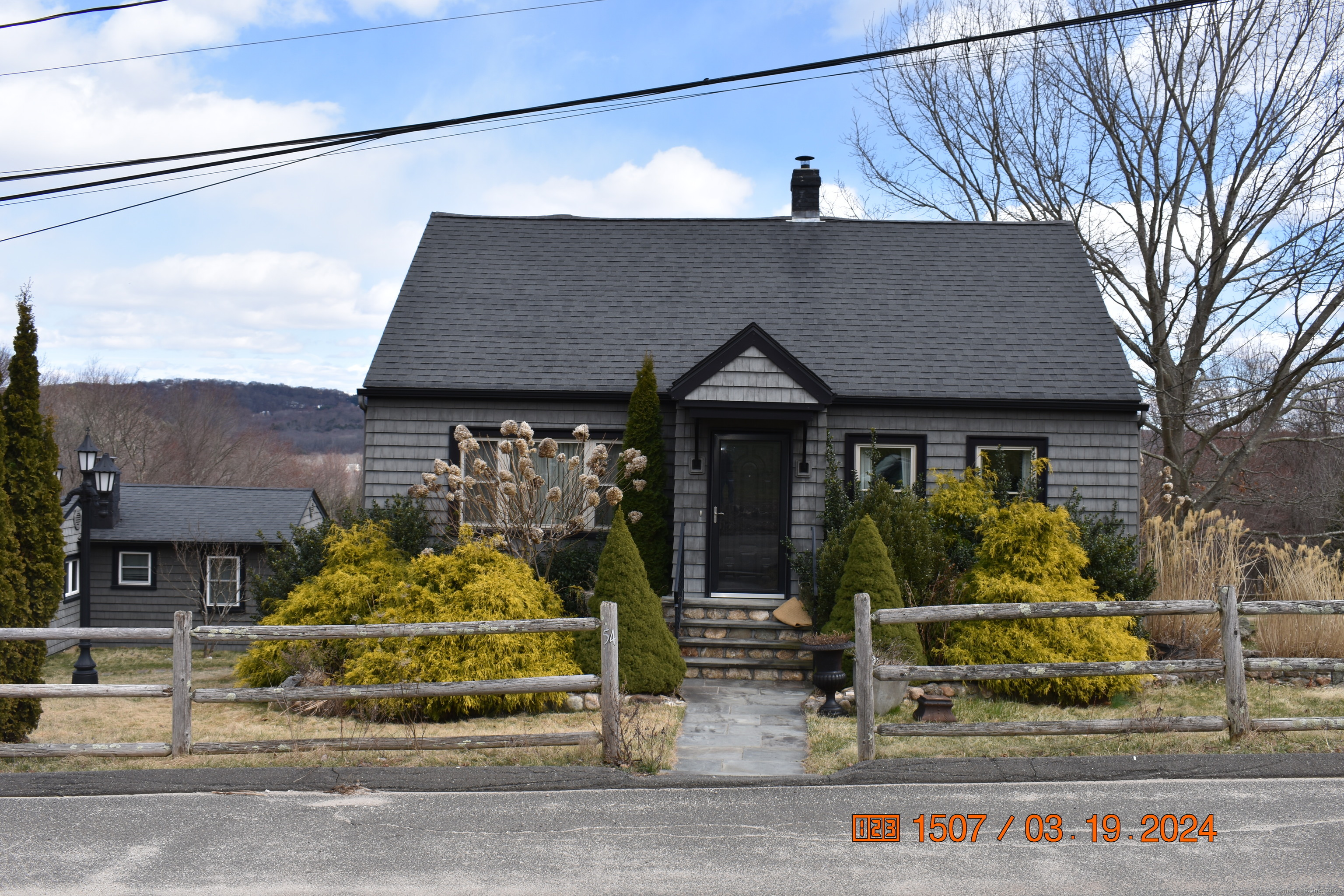 60 Old Colonial Road Watertown, CT 06779 - Photo 1 of 1 a front view of a house with garden