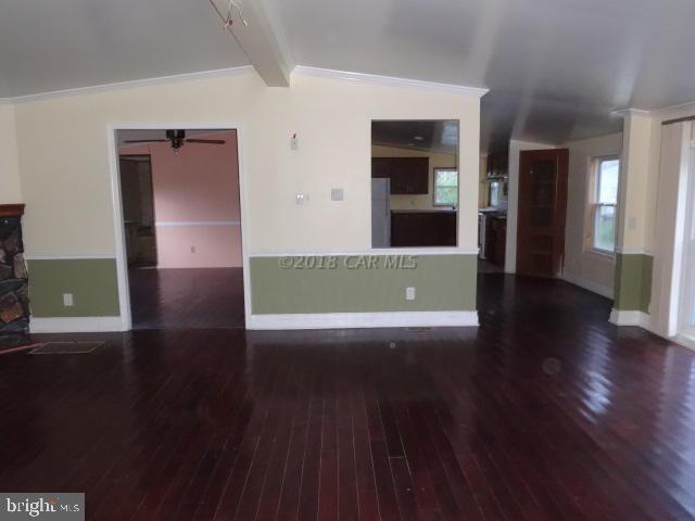 36778-3 3 Bridges Road Willards, MD 21874 - Photo 3 of 18 a view of a big room with wooden floor and windows