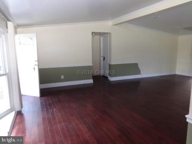 36778-3 3 Bridges Road Willards, MD 21874 - Photo 5 of 18 an empty room with wooden floor and windows