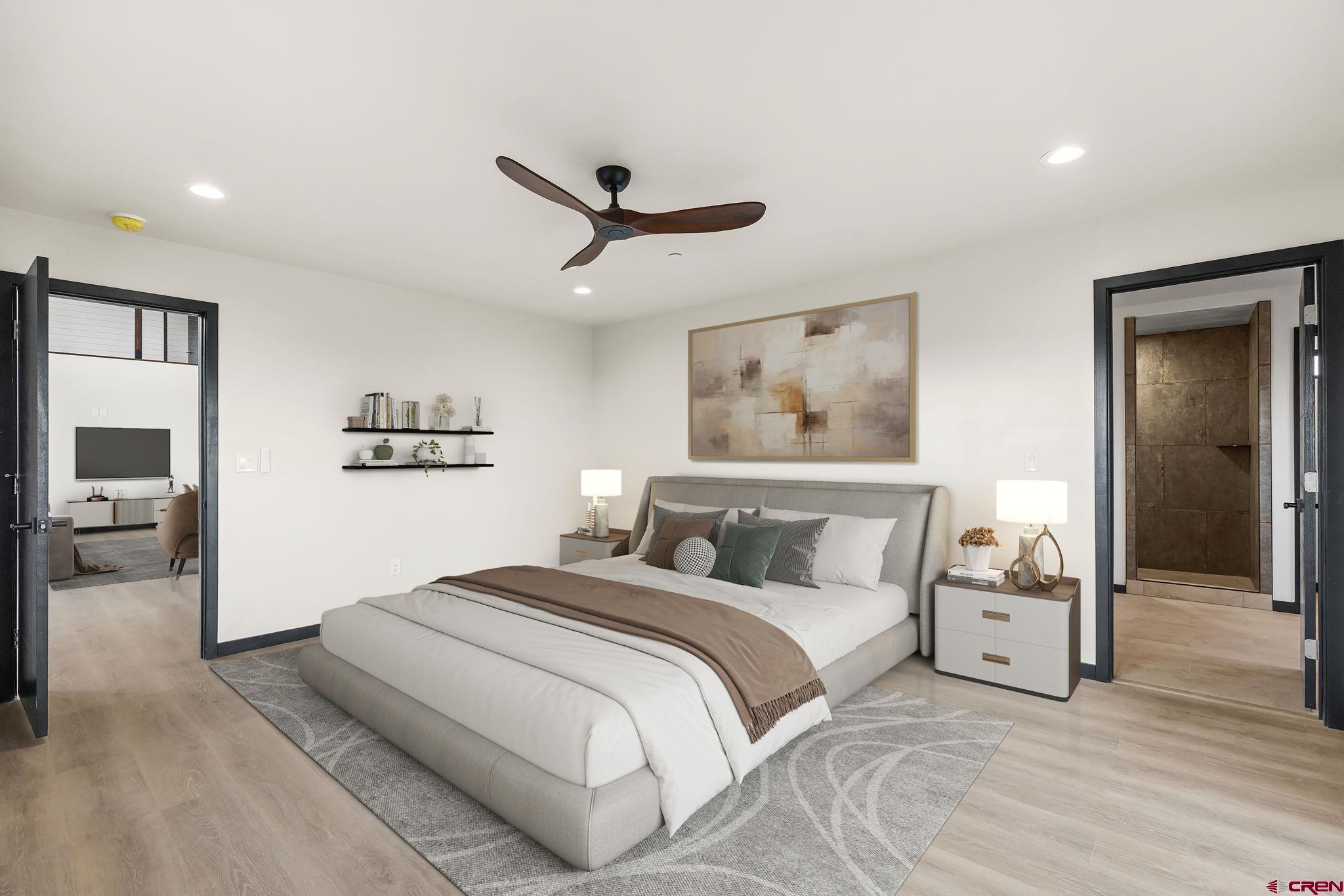 192 Rawhide Road Durango, CO 81303 - Photo 11 of 41 a bedroom with a bed and a chandelier