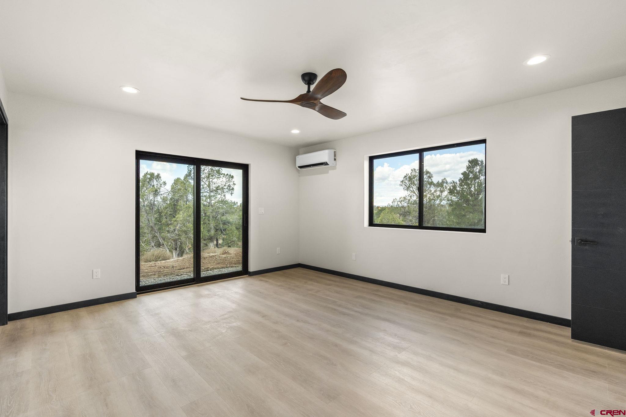 192 Rawhide Road Durango, CO 81303 - Photo 14 of 41 wooden floor in an empty room with a window