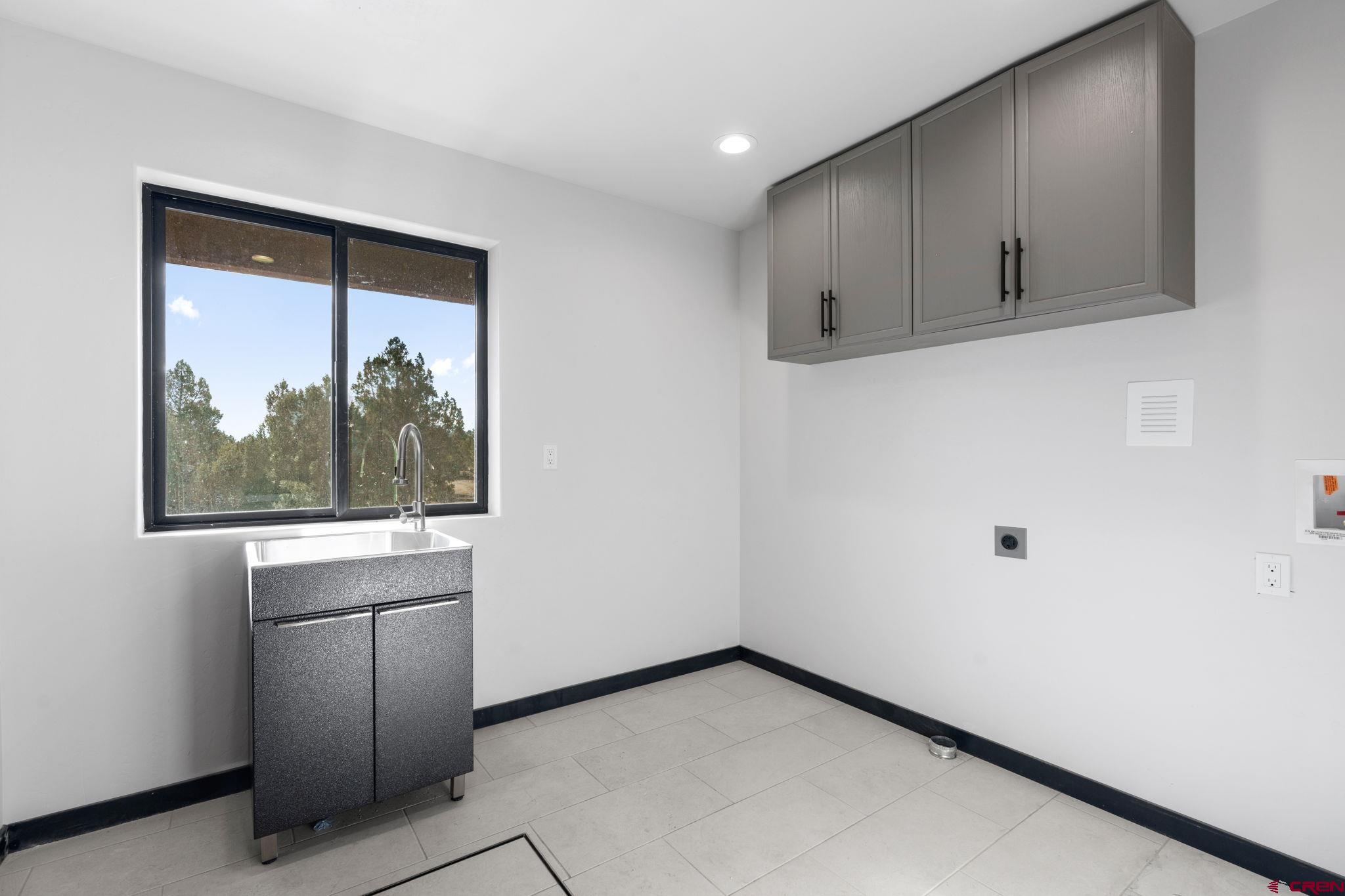 192 Rawhide Road Durango, CO 81303 - Photo 19 of 41 a view of a kitchen with wooden floor and a window