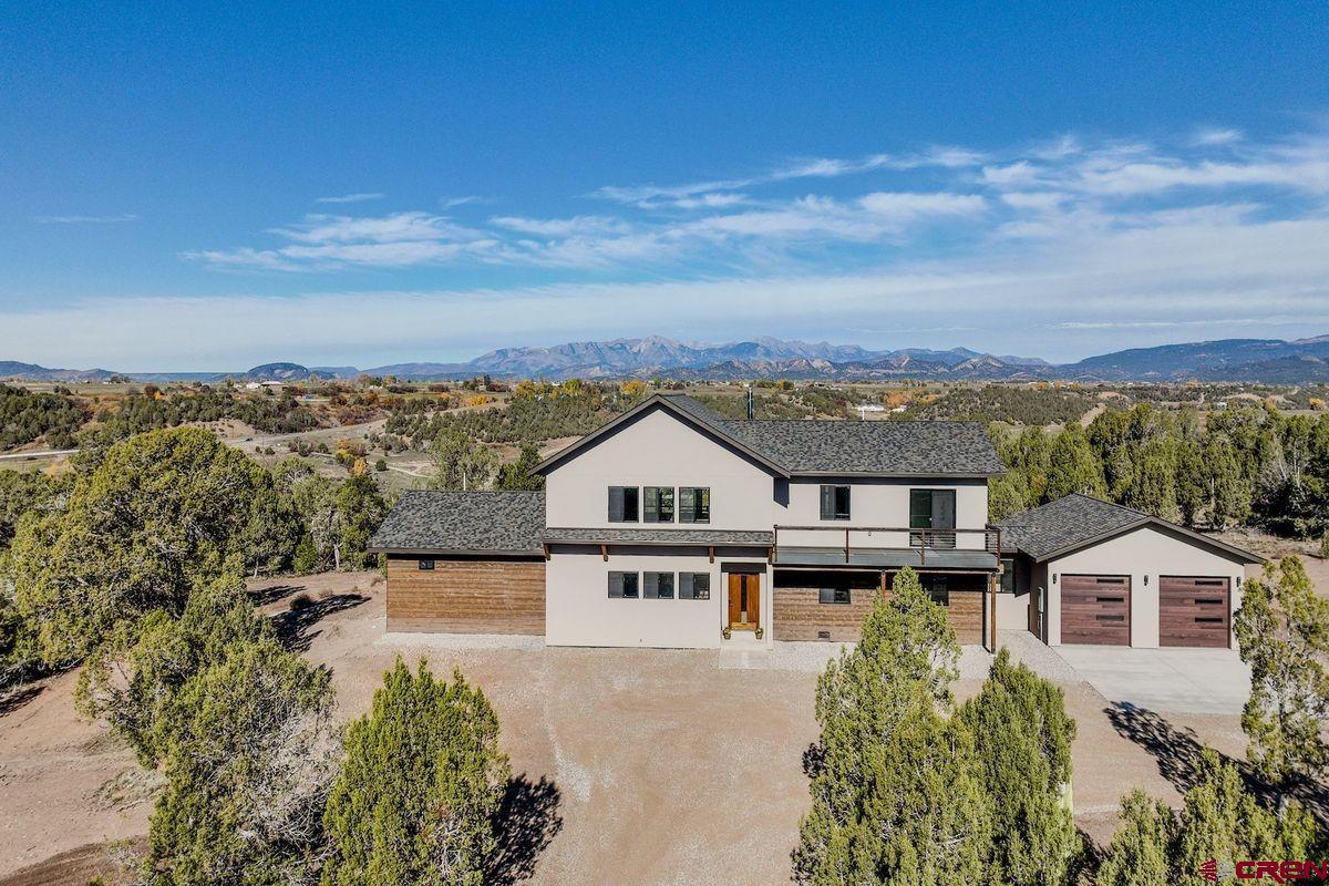 192 Rawhide Road Durango, CO 81303 - Photo 2 of 41 an aerial view of a house with a big yard