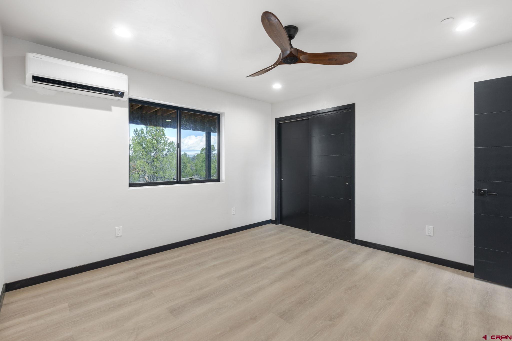 192 Rawhide Road Durango, CO 81303 - Photo 21 of 41 an empty room with a window and a ceiling fan