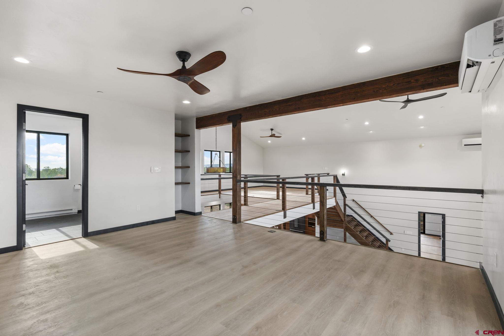 192 Rawhide Road Durango, CO 81303 - Photo 27 of 41 a view of a hallway with wooden floor