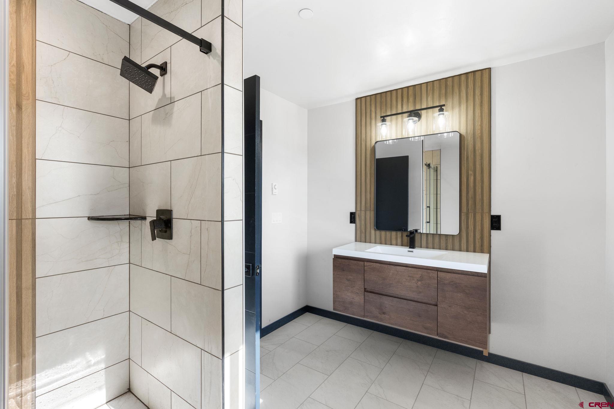 192 Rawhide Road Durango, CO 81303 - Photo 30 of 41 a bathroom with a bathtub and a shower