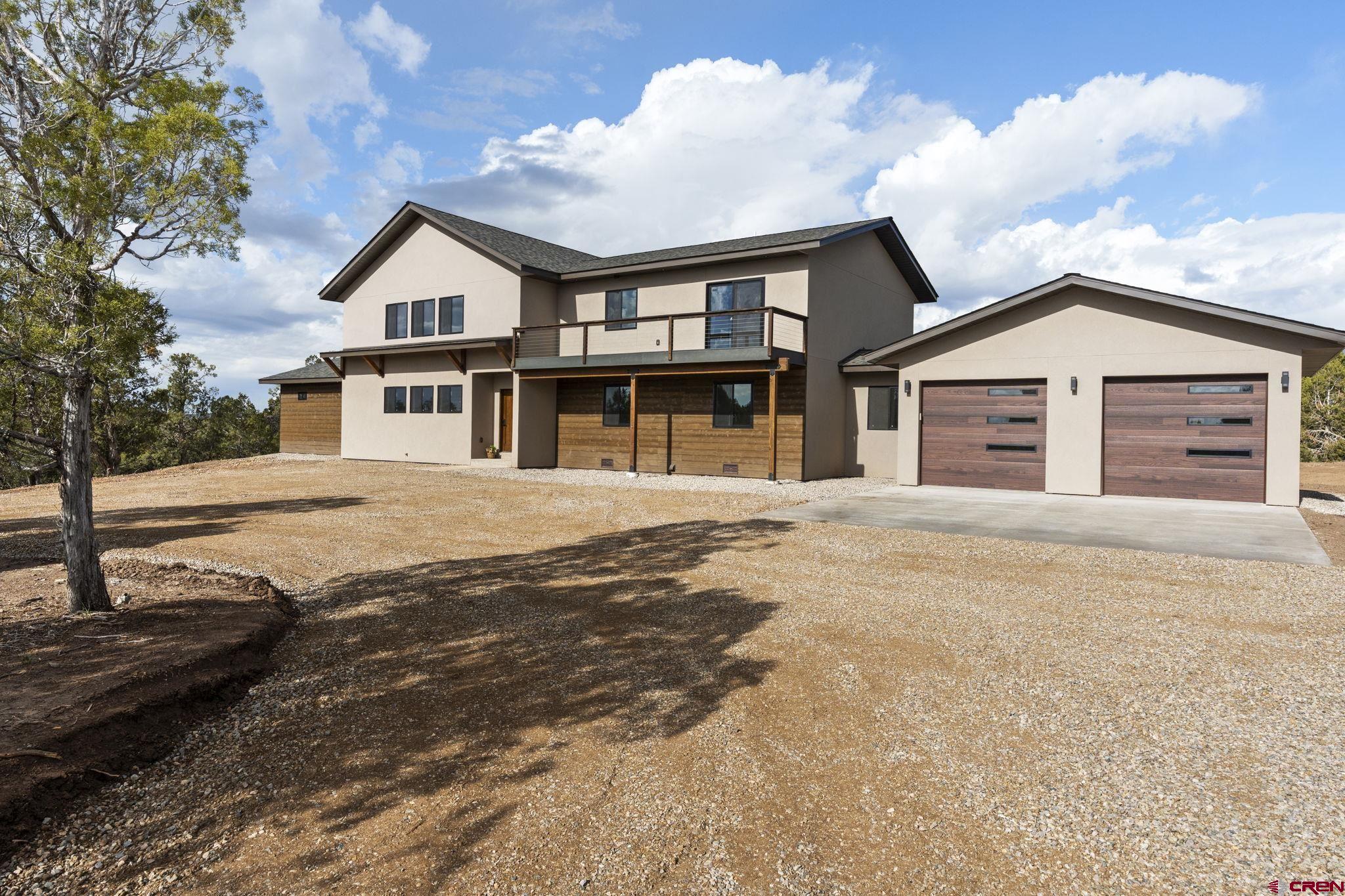 192 Rawhide Road Durango, CO 81303 - Photo 34 of 41 a front view of a house with a yard