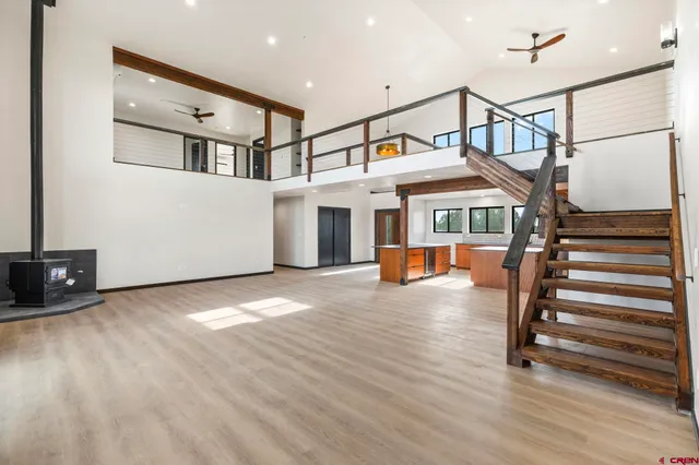 a view of entryway hall and hall with wooden floor