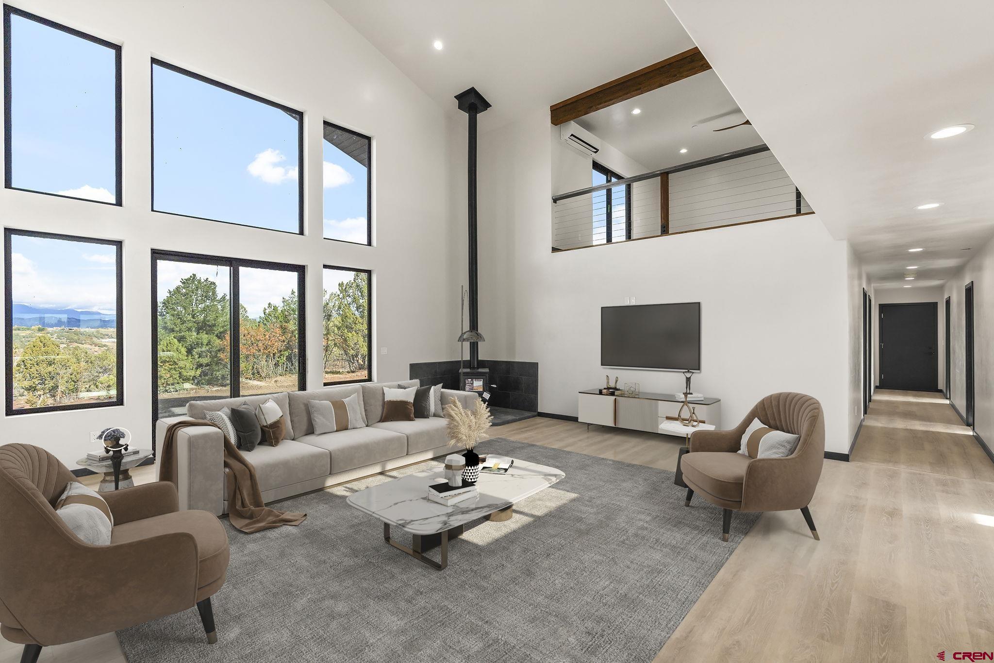 192 Rawhide Road Durango, CO 81303 - Photo 8 of 41 a living room with furniture and a flat screen tv