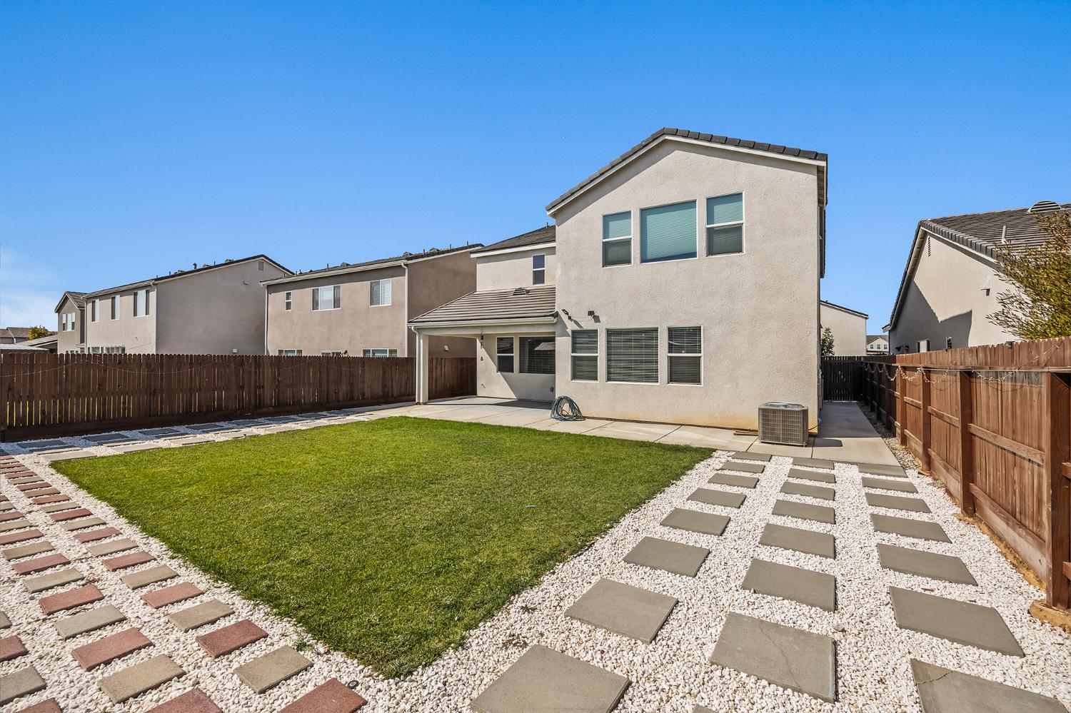 153 Boulder Drive Madera, CA 93636 - Photo 30 of 32 a front view of a house with a yard