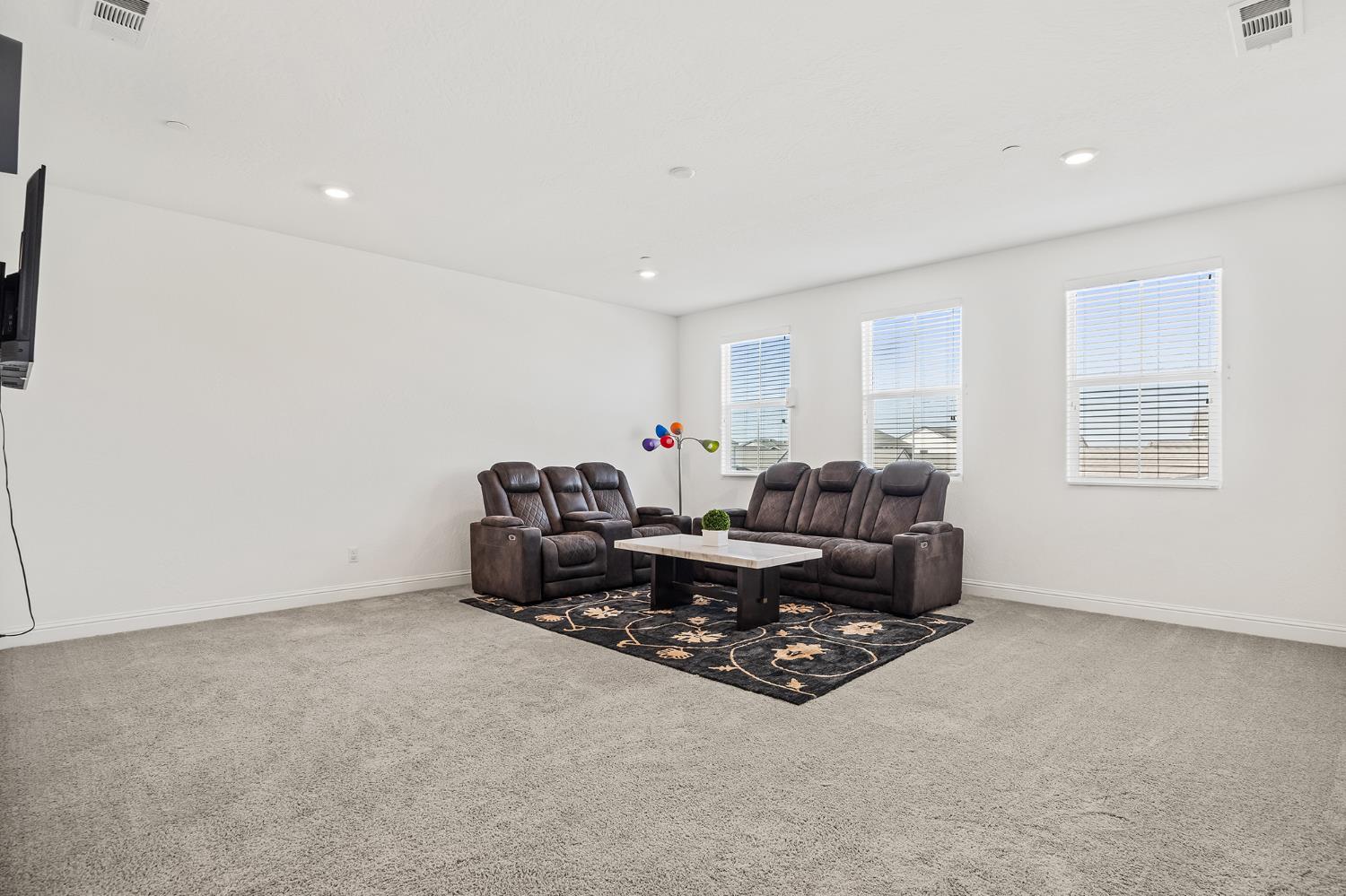 153 Boulder Drive Madera, CA 93636 - Photo 7 of 32 a living room with furniture and a window