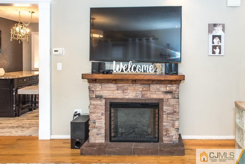 29 Mercer Road Old Bridge, NJ 08857 - Photo 3 of 24 a view of a livingroom with a fireplace and window