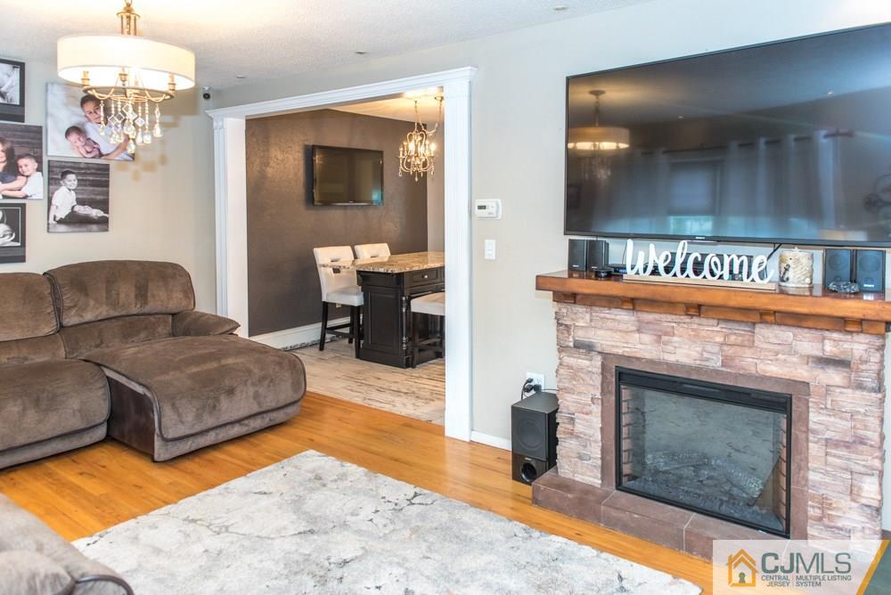 29 Mercer Road Old Bridge, NJ 08857 - Photo 4 of 24 a living room with furniture and a fireplace