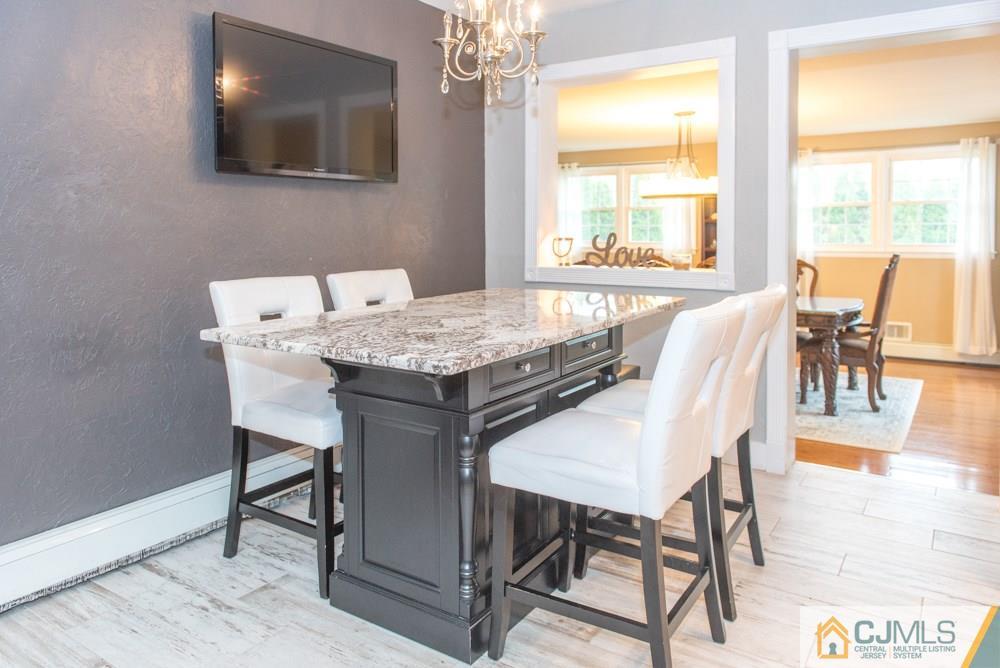29 Mercer Road Old Bridge, NJ 08857 - Photo 5 of 24 a view of a dining room with furniture and wooden floor