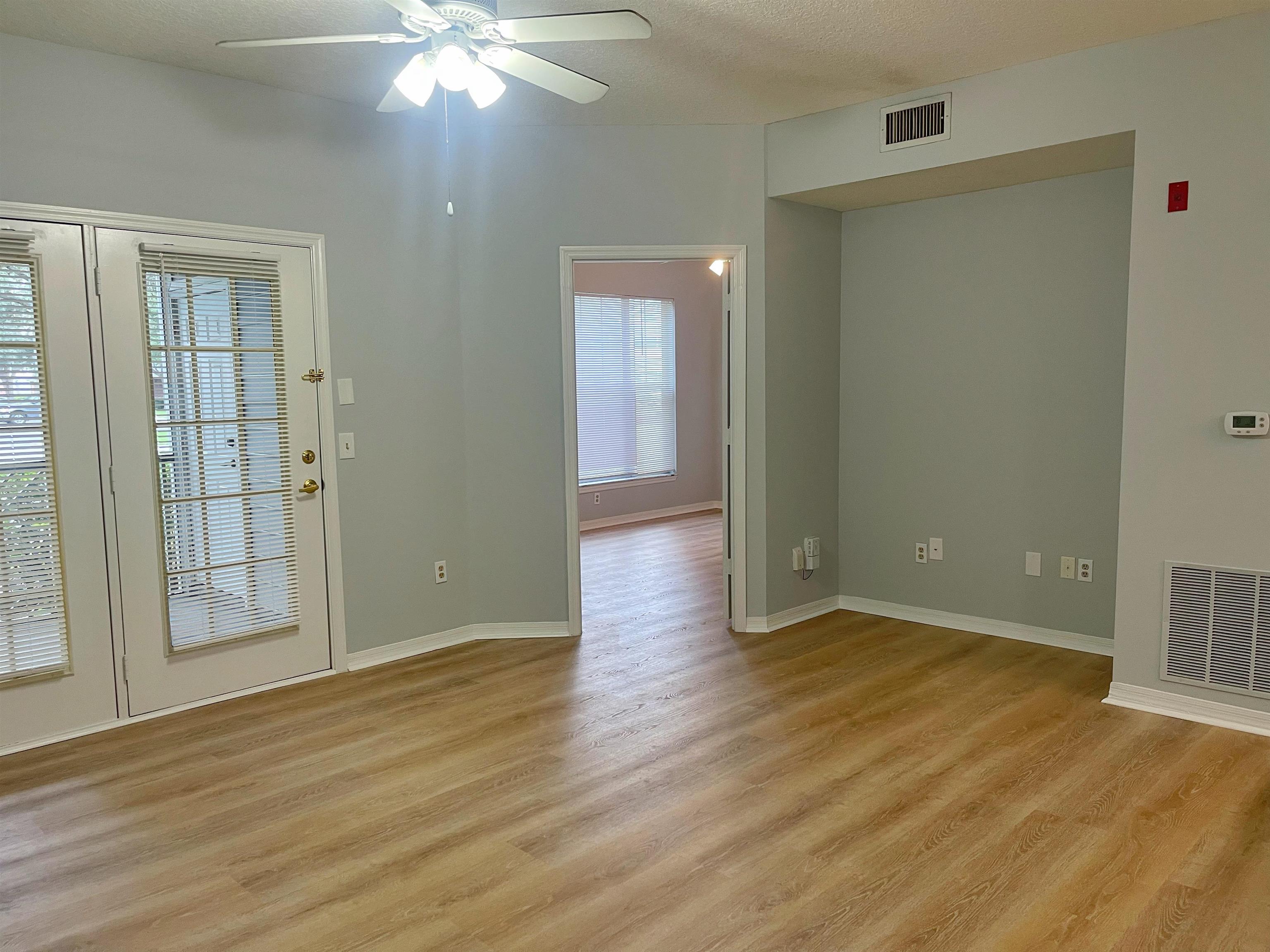 17-101 Harbour Vista Circle St. Augustine, FL 32080 - Photo 11 of 29 a view of an empty room with wooden floor and a window