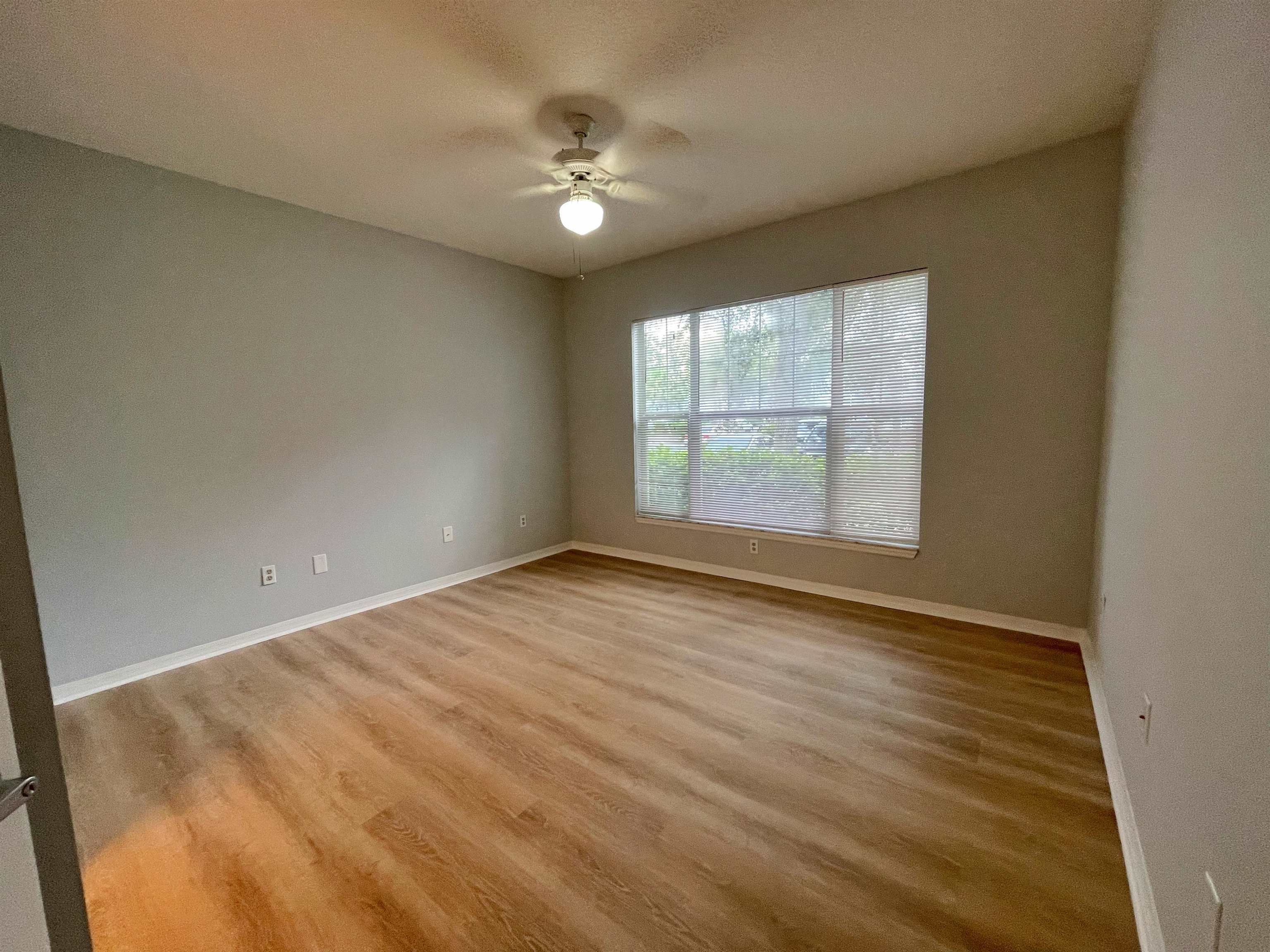 17-101 Harbour Vista Circle St. Augustine, FL 32080 - Photo 14 of 29 an empty room with wooden floor and windows
