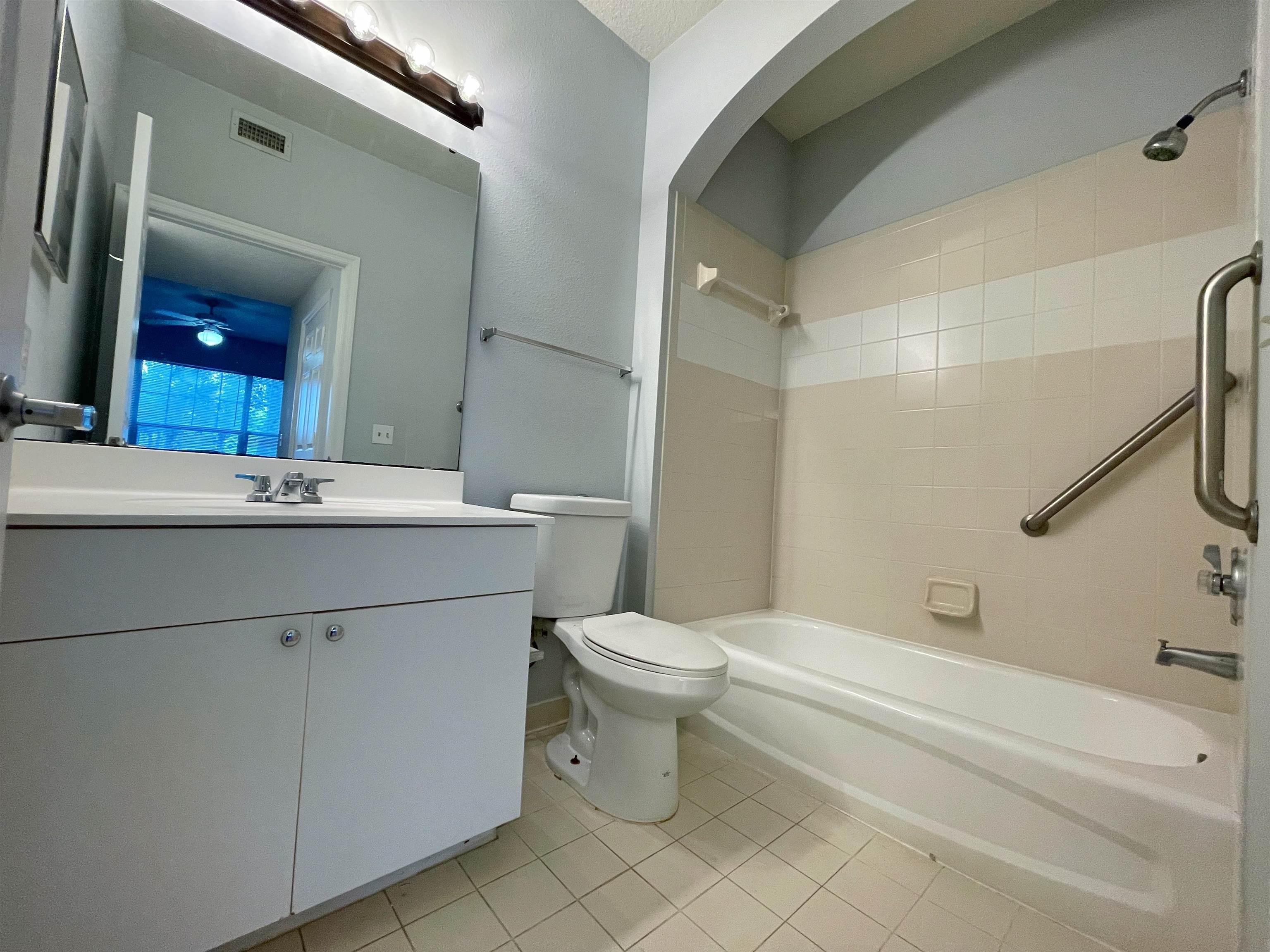 17-101 Harbour Vista Circle St. Augustine, FL 32080 - Photo 16 of 29 a bathroom with a sink a toilet and shower