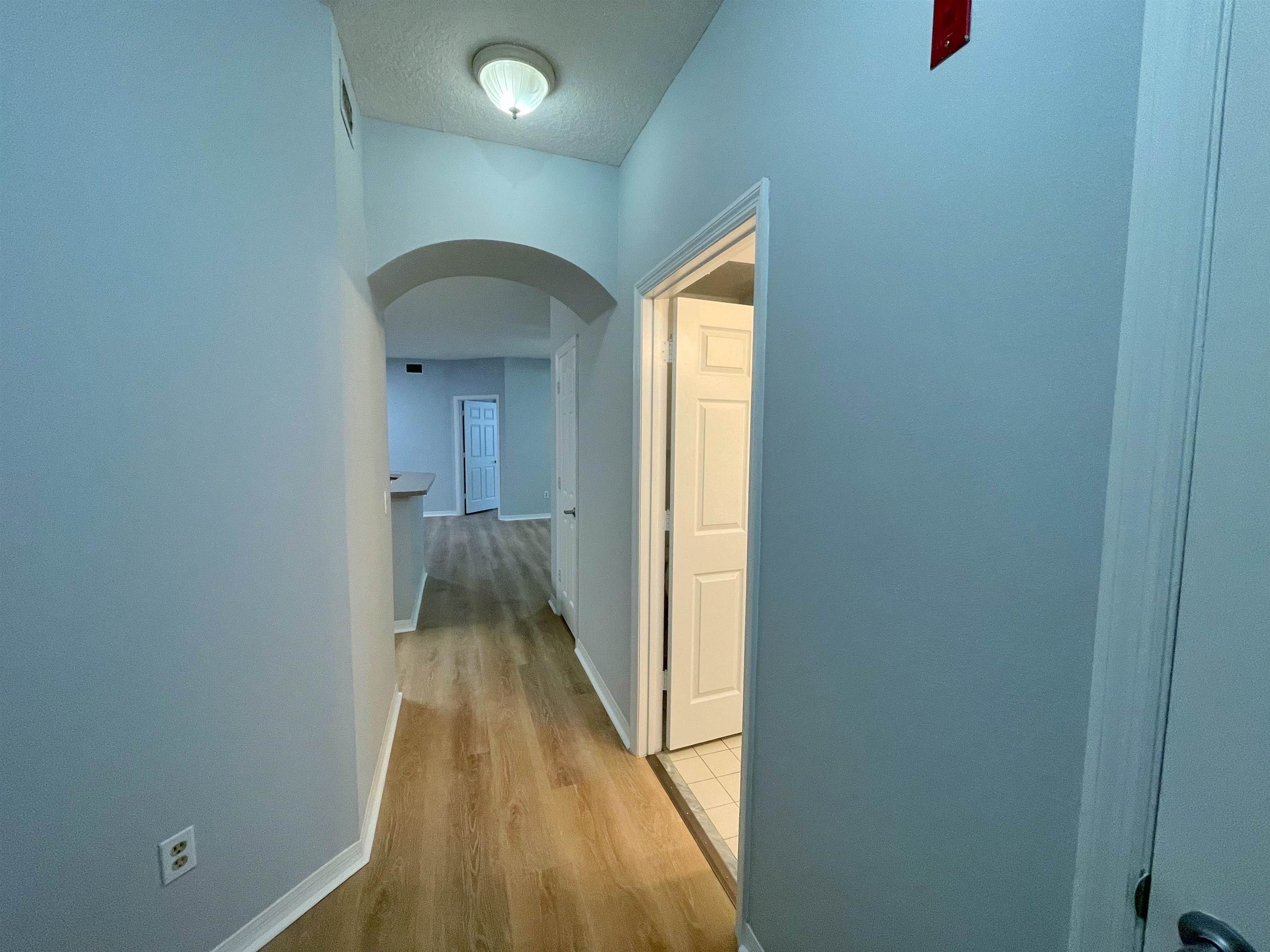 17-101 Harbour Vista Circle St. Augustine, FL 32080 - Photo 2 of 29 a view of a hallway with wooden floor and closet
