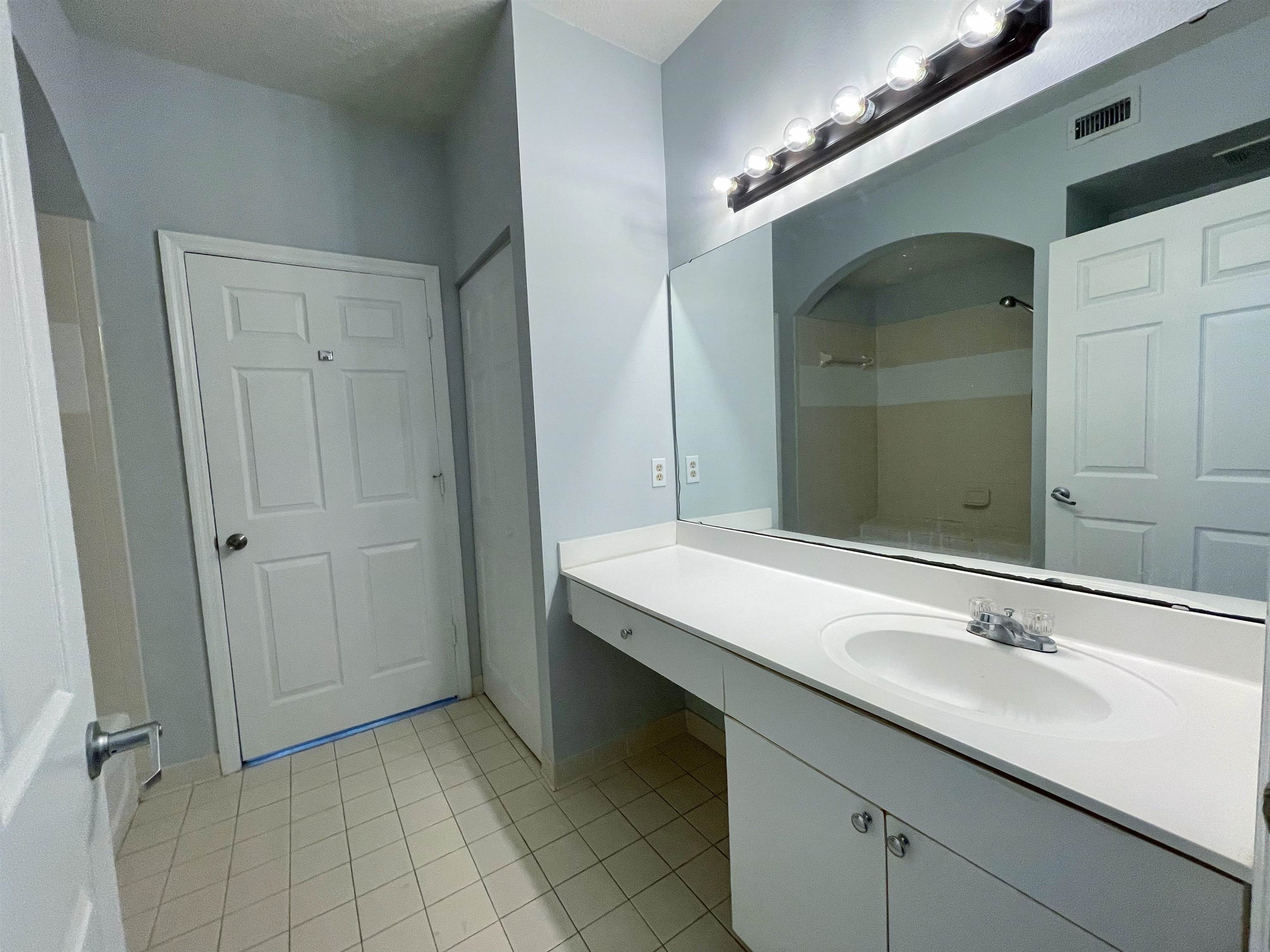 17-101 Harbour Vista Circle St. Augustine, FL 32080 - Photo 22 of 29 a bathroom with a sink and a mirror