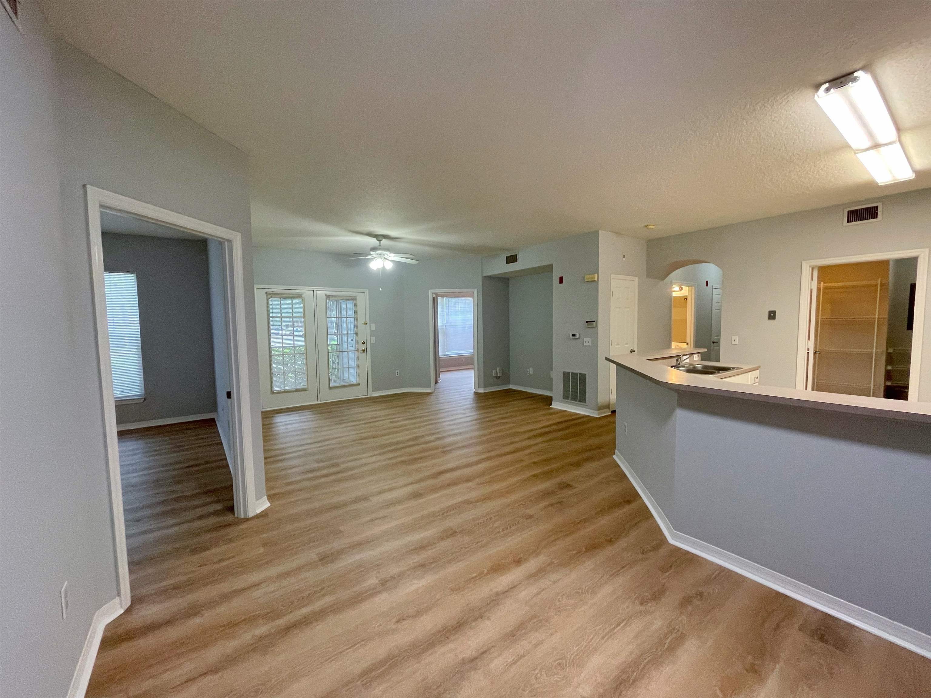 17-101 Harbour Vista Circle St. Augustine, FL 32080 - Photo 9 of 29 a view of kitchen and hall with wooden floor