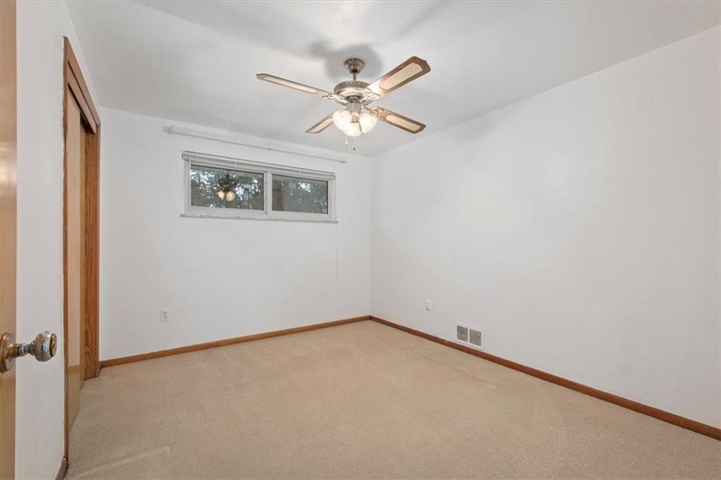 158 McConnell Road McDonald, PA 15057 - Photo 11 of 24 an empty room with a window and a fan