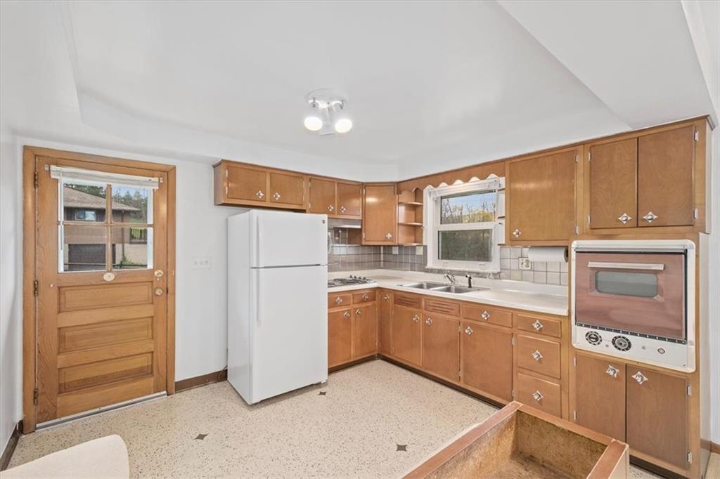 158 McConnell Road McDonald, PA 15057 - Photo 7 of 24 a kitchen with a refrigerator and cabinets