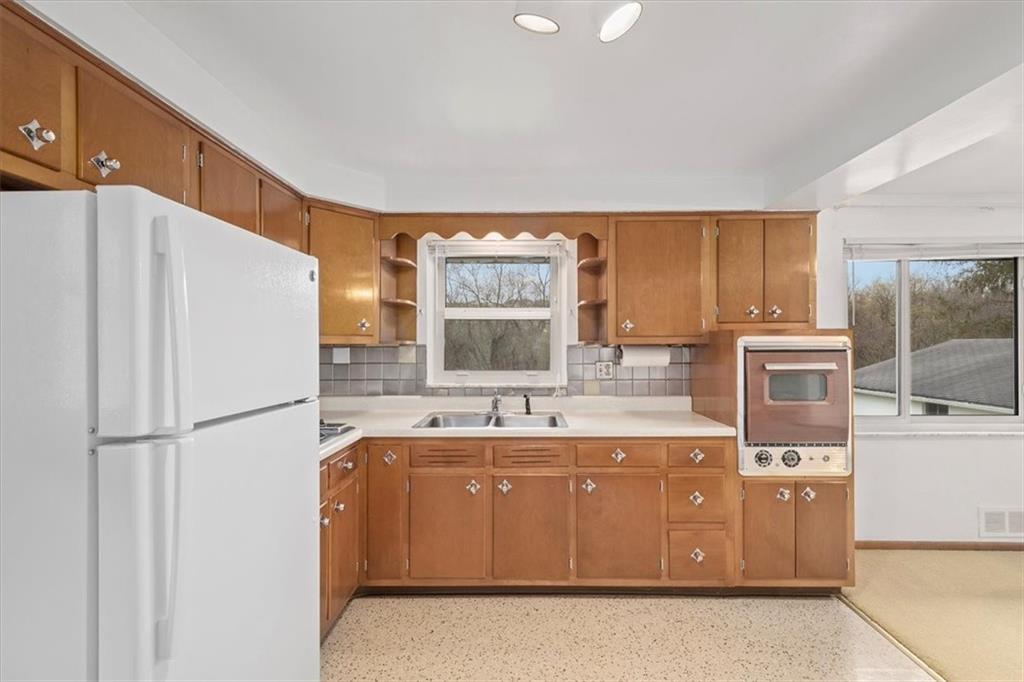158 McConnell Road McDonald, PA 15057 - Photo 8 of 24 a kitchen with a stove a refrigerator and a sink