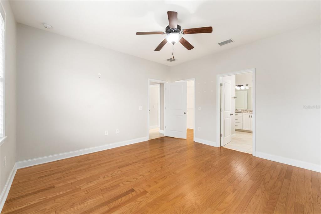 16617 Northwest 194th Street High Springs, FL 32643 - Photo 16 of 32 a view of empty room with wooden floor and ceiling fan