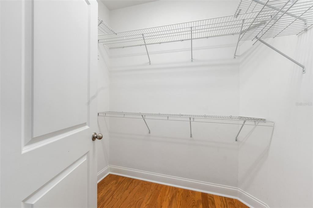 16617 Northwest 194th Street High Springs, FL 32643 - Photo 18 of 32 a view of walk in closet with racks on the wall