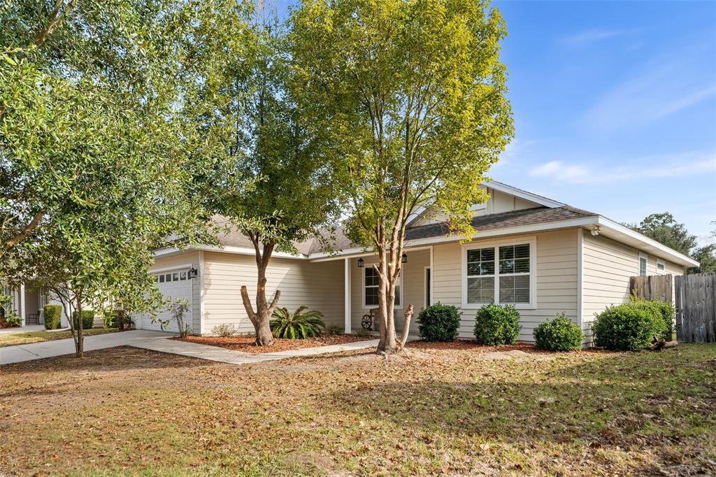 16617 Northwest 194th Street High Springs, FL 32643 - Photo 2 of 32 a front view of a house with a garden