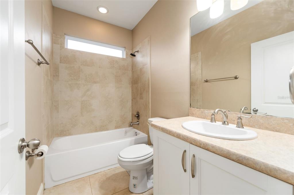 16617 Northwest 194th Street High Springs, FL 32643 - Photo 24 of 32 a bathroom with a sink a toilet and shower