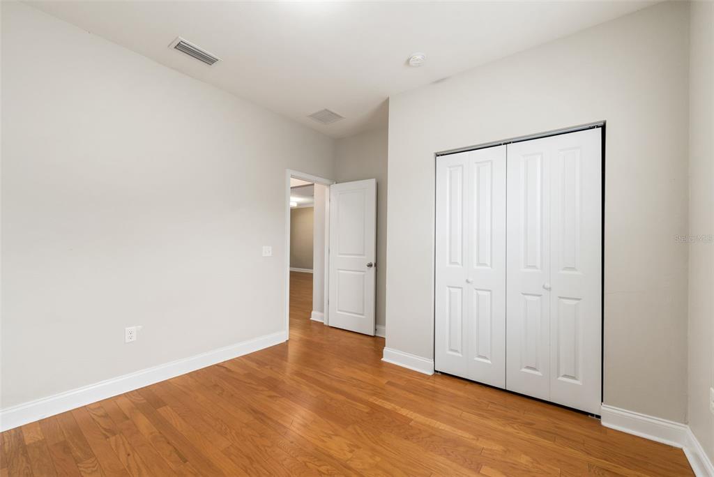 16617 Northwest 194th Street High Springs, FL 32643 - Photo 26 of 32 a view of an empty room and wooden floor