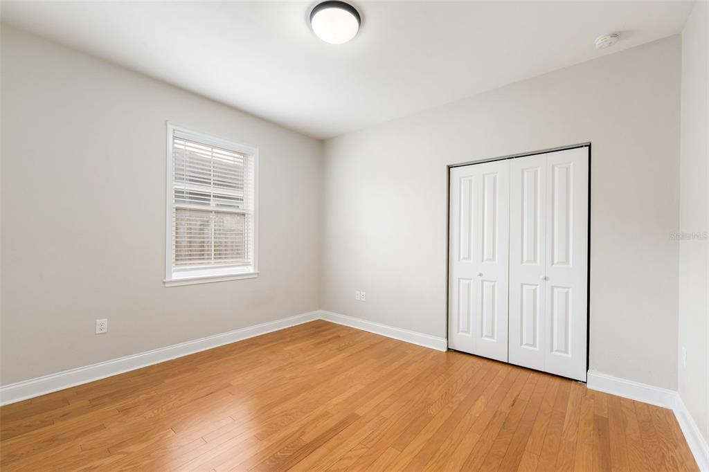 16617 Northwest 194th Street High Springs, FL 32643 - Photo 28 of 32 an empty room with wooden floor and windows